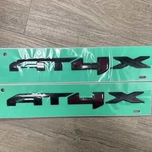 AT4X Black and Red Vehicle Emblem / Nameplate